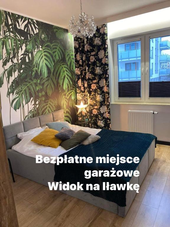 Posteľ alebo postele v izbe v ubytovaní Apartament Tomek