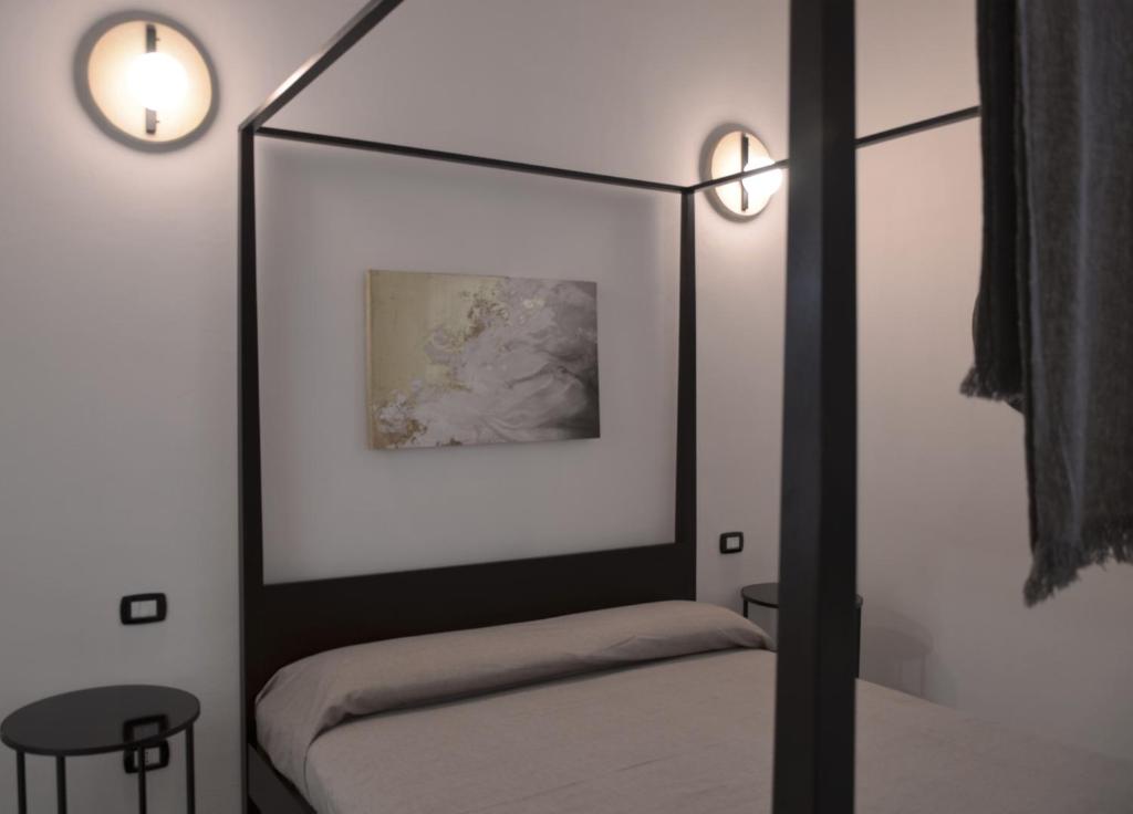 Łóżko lub łóżka w pokoju w obiekcie The Court Suites & Spa