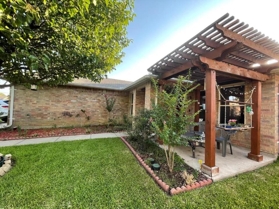 a pergola in the backyard of a house at Private room in Dallas in Dallas