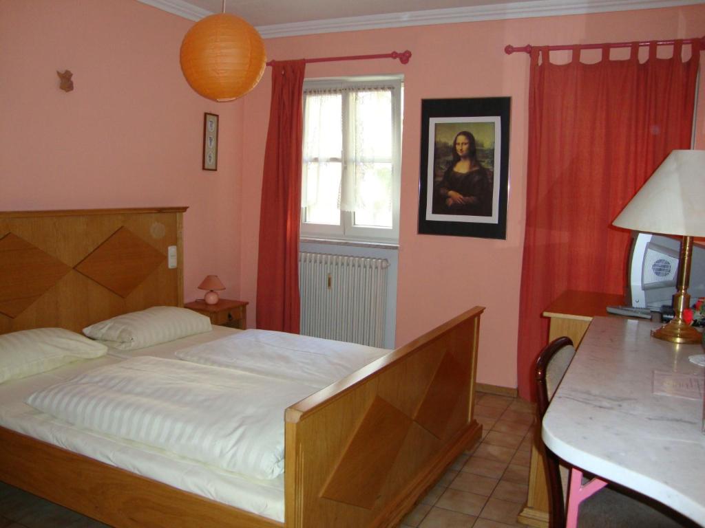 Postel nebo postele na pokoji v ubytování Pension Mona Lisa