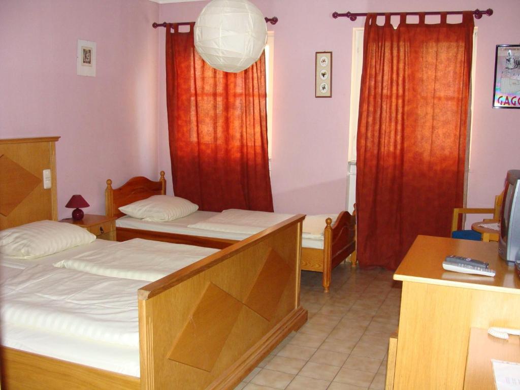 Postel nebo postele na pokoji v ubytování Pension Mona Lisa