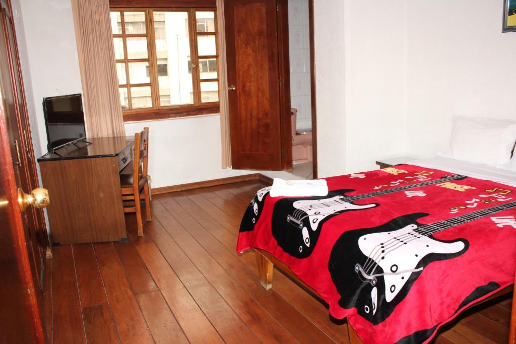 Postel nebo postele na pokoji v ubytování Hostal La Catolica
