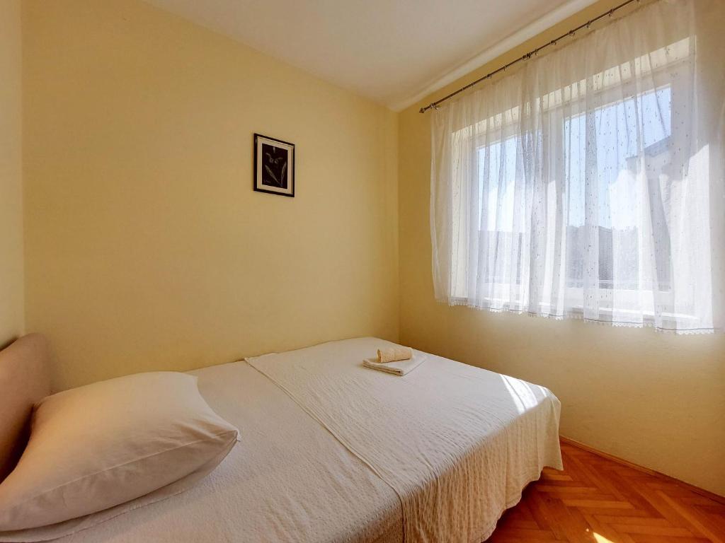 Postel nebo postele na pokoji v ubytování Apartments Nikola