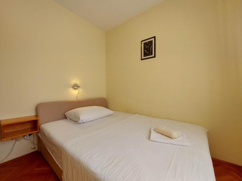 Postel nebo postele na pokoji v ubytování Apartments Nikola