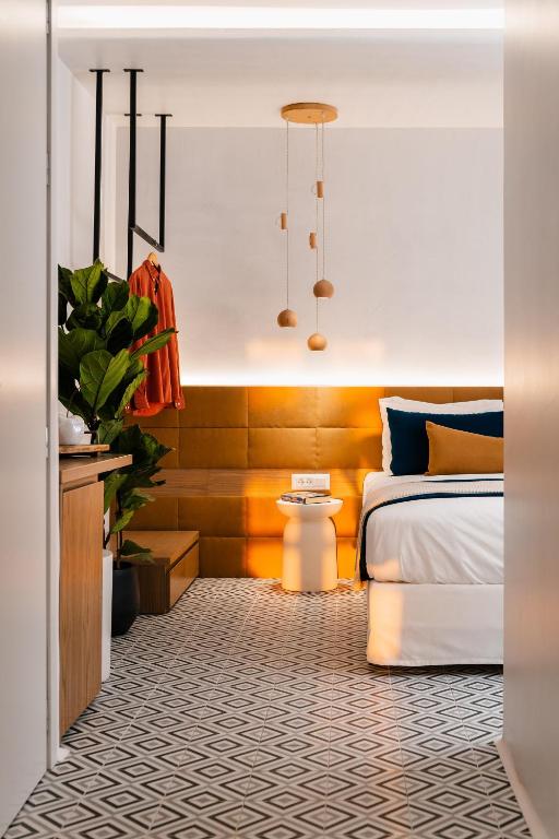 Postel nebo postele na pokoji v ubytování Margaret Luxury Suites