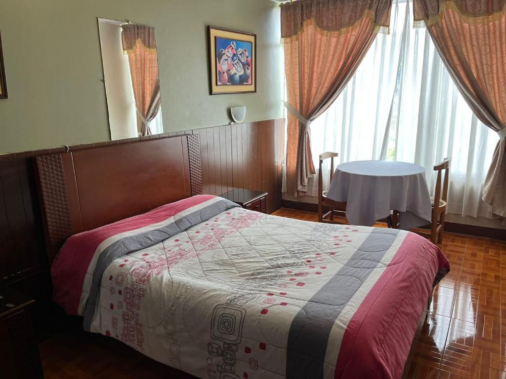 Postel nebo postele na pokoji v ubytování Hotel Cotopaxi