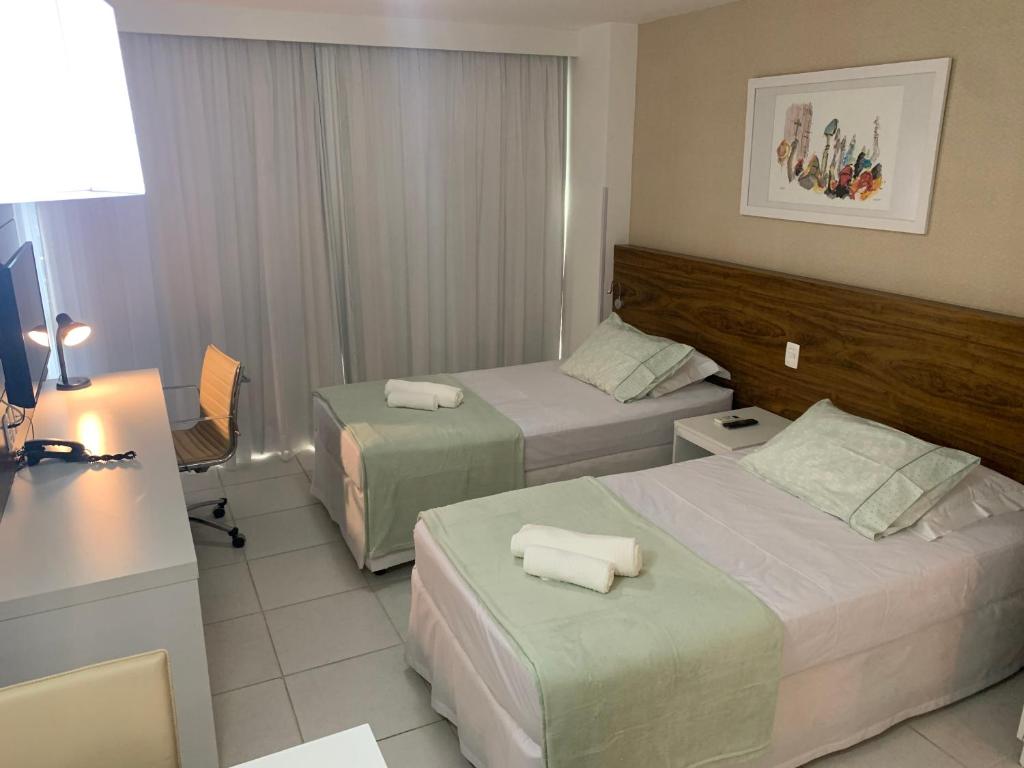 Säng eller sängar i ett rum på KMT Comfort Flat