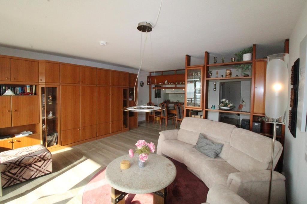 a living room with a couch and a table at Panorama Whg 62, 4 OG in Cuxhaven