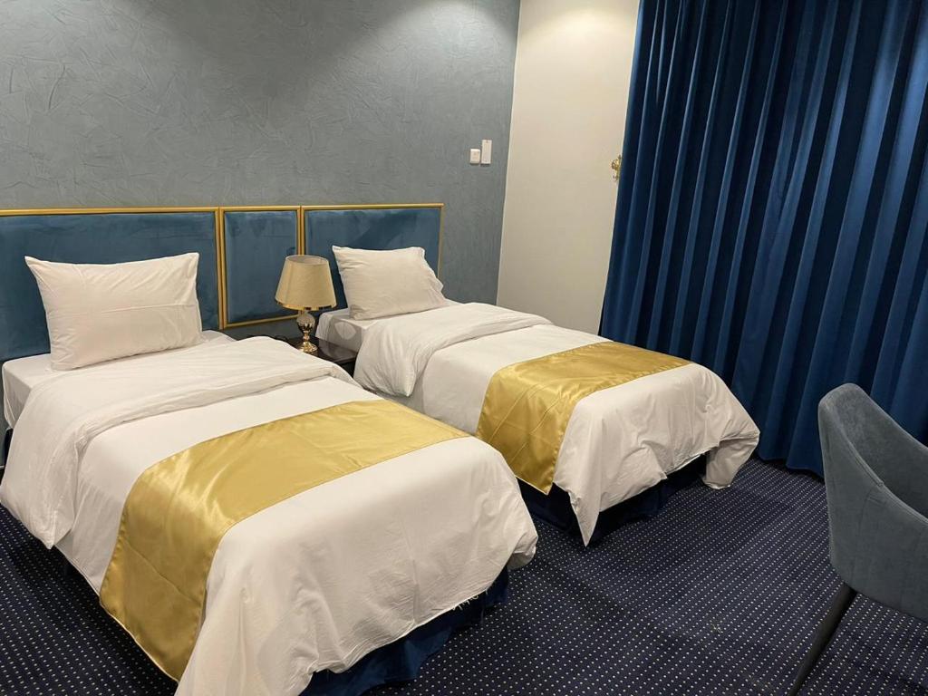 Postel nebo postele na pokoji v ubytování منازل الشمال للشقق المخدومة Manazel Al Shamal Serviced Apartments