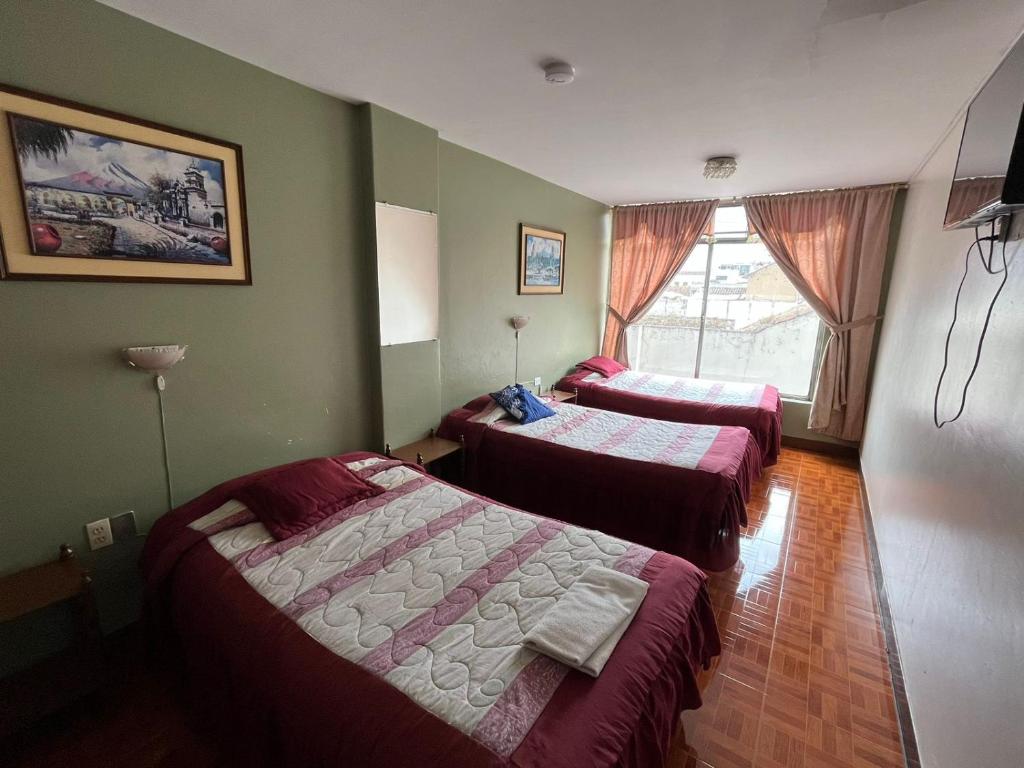 Postel nebo postele na pokoji v ubytování Hotel Cotopaxi