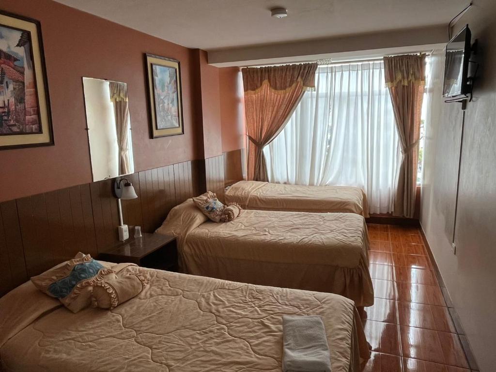 Postel nebo postele na pokoji v ubytování Hotel Cotopaxi