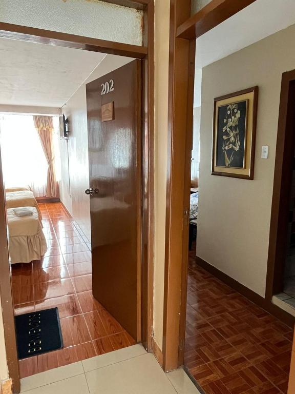 Postel nebo postele na pokoji v ubytování Hotel Cotopaxi