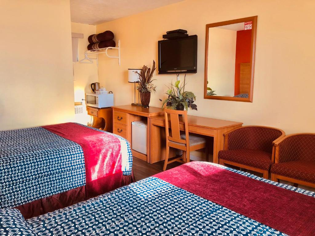 Postel nebo postele na pokoji v ubytování Martin's Inn