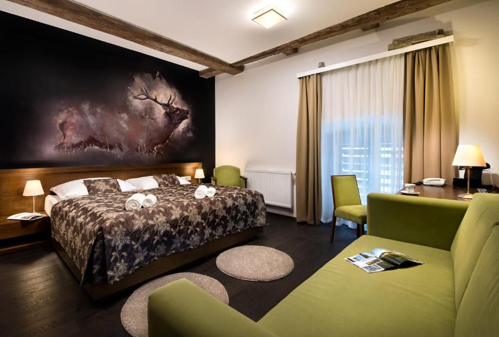 Łóżko lub łóżka w pokoju w obiekcie Hotel Tvrz Orlice
