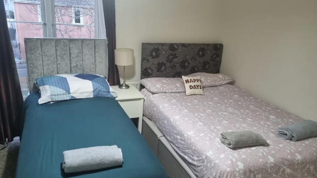 two beds sitting next to each other in a bedroom at Ballentree Stay in Dublin