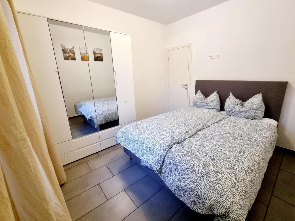 Postel nebo postele na pokoji v ubytování Apartments Žman