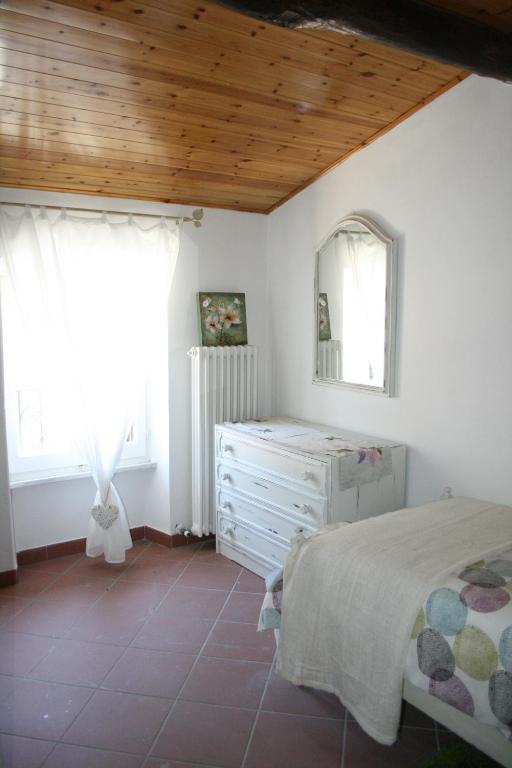 Postel nebo postele na pokoji v ubytování Ca' Rossi