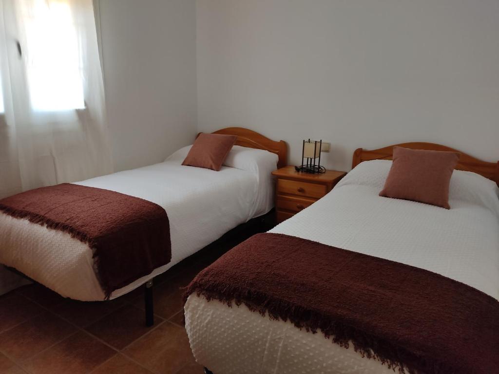 Postel nebo postele na pokoji v ubytování CASA RURAL VELEFIQuE
