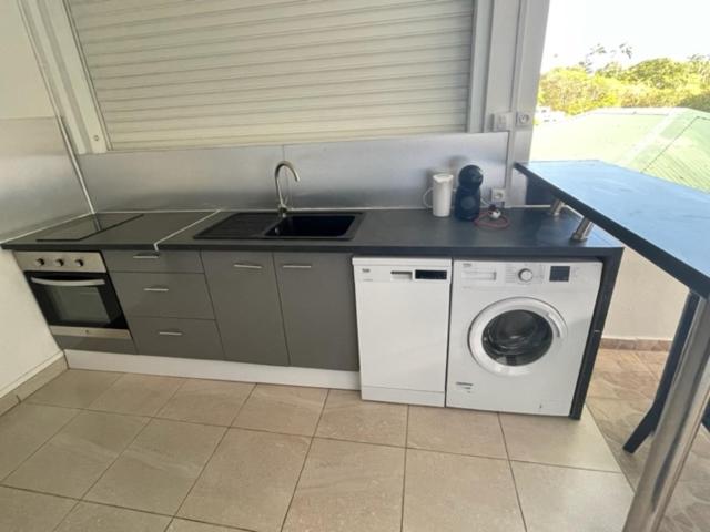 Kuchyň nebo kuchyňský kout v ubytování Residence Chez Marraine Maison BERTILI