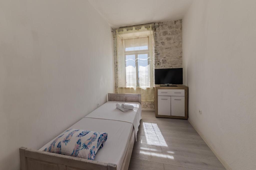 Posteľ alebo postele v izbe v ubytovaní A1 - spacious apt on the seafront with terrace