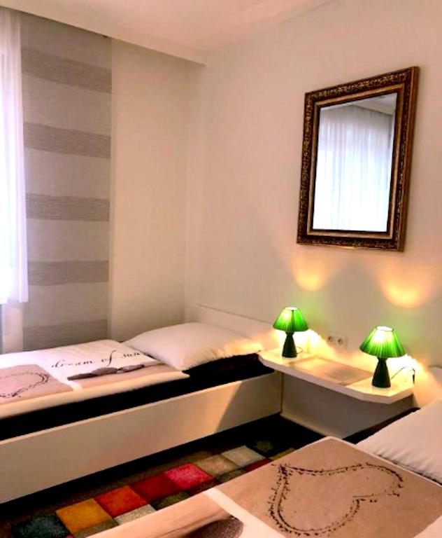 Postel nebo postele na pokoji v ubytování Hotel Uthoff