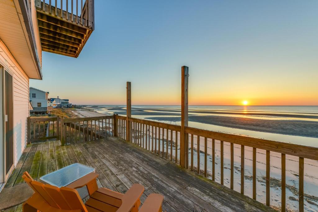 a balcony with chairs and a view of the beach at Bayfront Cape May Vacation Rental with Beach Access in Cape May Court House
