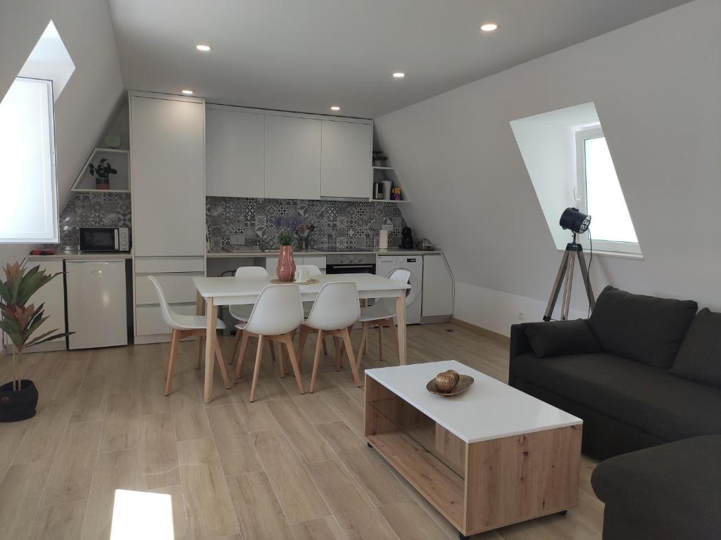 a living room with a couch and a table at Aveiro Ria House E in Aveiro