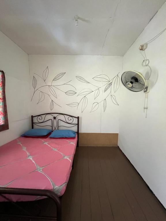 Кровать или кровати в номере Mulu Village