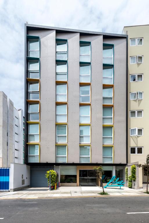 a building with balconies on the side of it at Libre Hotel, BW Signature Collection by Best Western in Lima