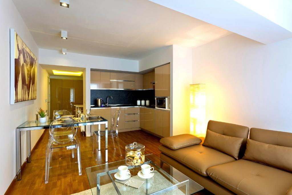 a living room with a couch and a table at The Place Suit & Apartments in Istanbul