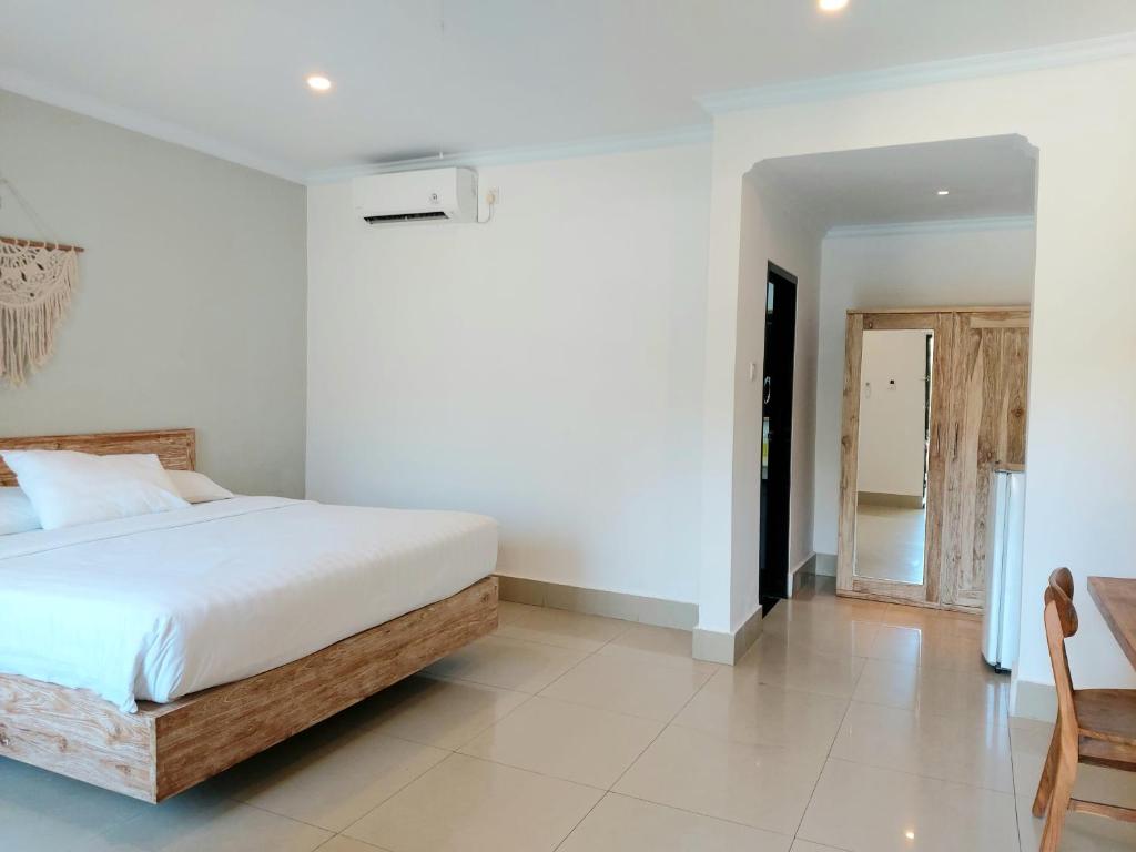 Postel nebo postele na pokoji v ubytování Radha Bali Hotel