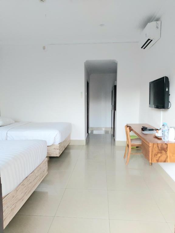 Postel nebo postele na pokoji v ubytování Radha Bali Hotel