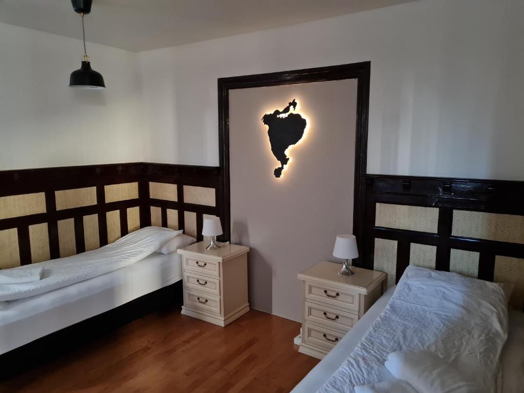 Postel nebo postele na pokoji v ubytování Lava Guesthouse