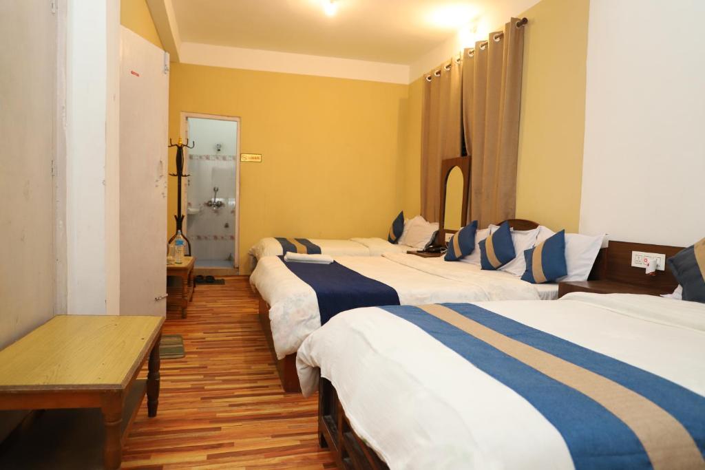 Krevet ili kreveti u jedinici u objektu Hotel Pathibhara