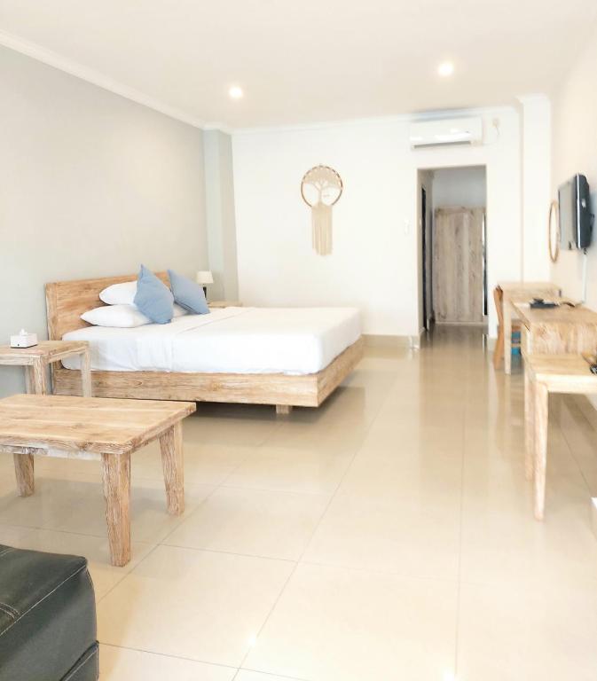 Postel nebo postele na pokoji v ubytování Radha Bali Hotel