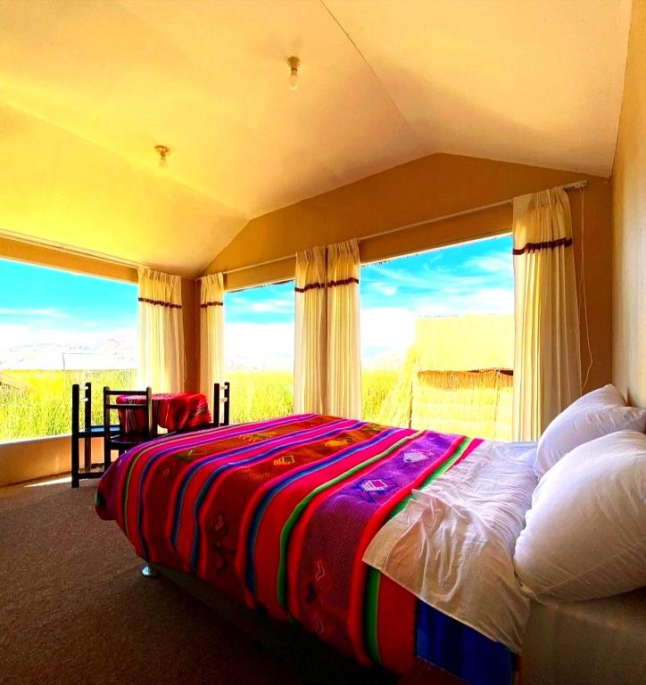 Postel nebo postele na pokoji v ubytování Uros Maya Lodge