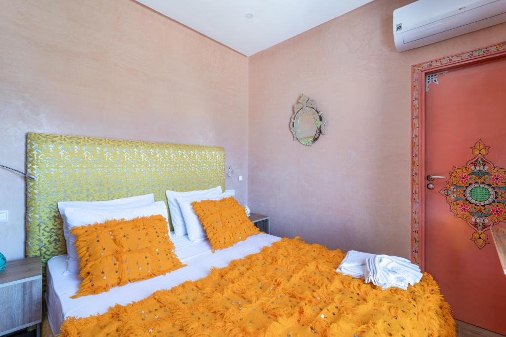 A bed or beds in a room at Riad Les Nuits De Fès