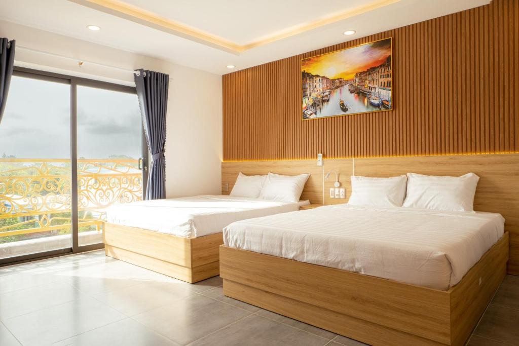 Giường trong phòng chung tại Ngọc Anh Hotel