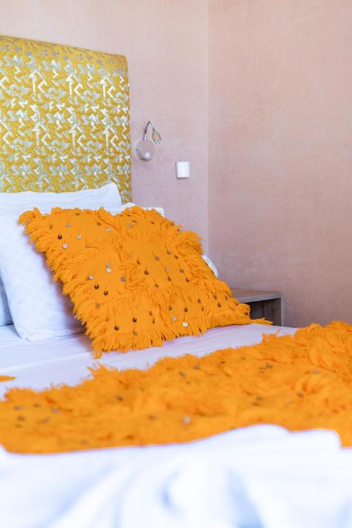 A bed or beds in a room at Riad Les Nuits De Fès