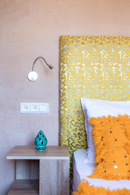 A bed or beds in a room at Riad Les Nuits De Fès