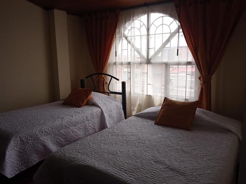 Postel nebo postele na pokoji v ubytování Habitaciones C&S Bogotá