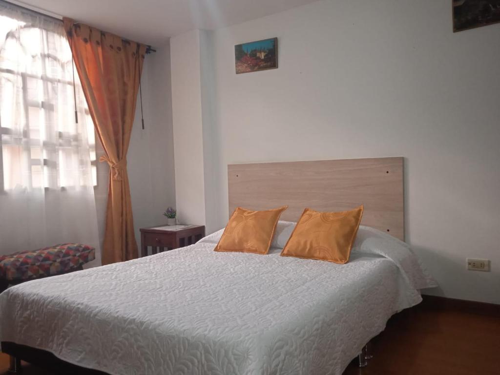 Postel nebo postele na pokoji v ubytování Habitaciones C&S Bogotá