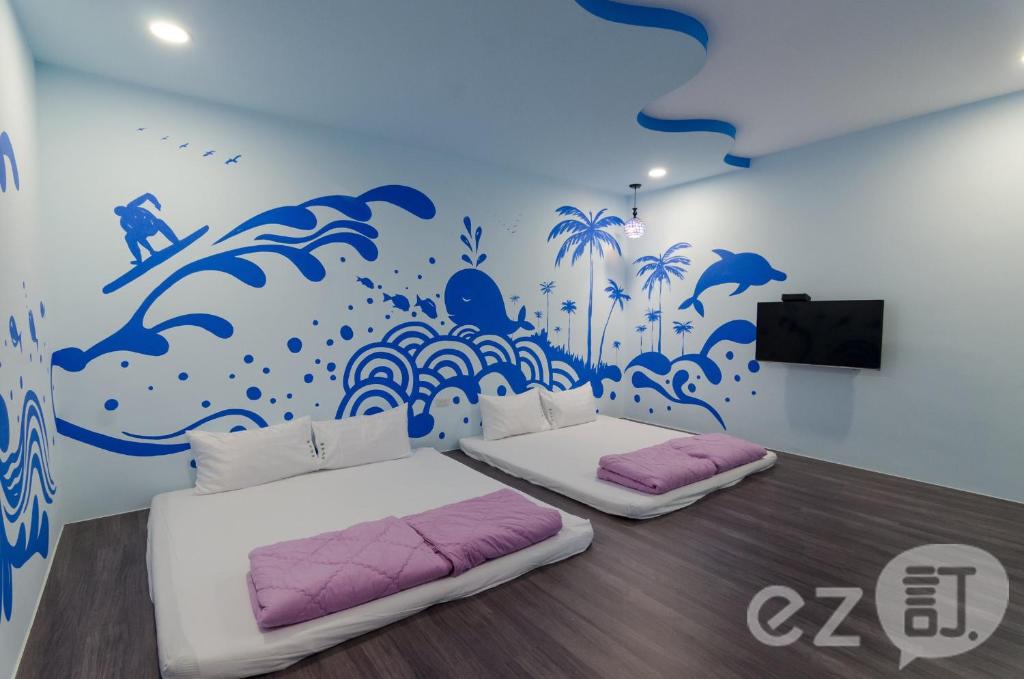 Postel nebo postele na pokoji v ubytování Mu Yu B&B