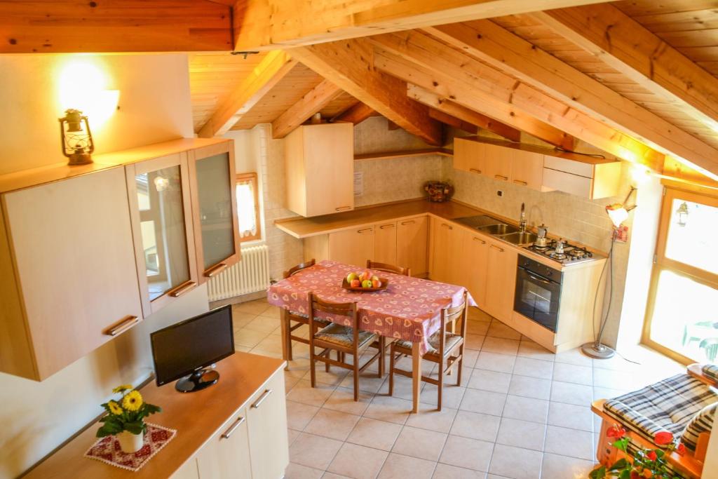 an overhead view of a kitchen with a table at Agritur de Poda Apartments in Flavon