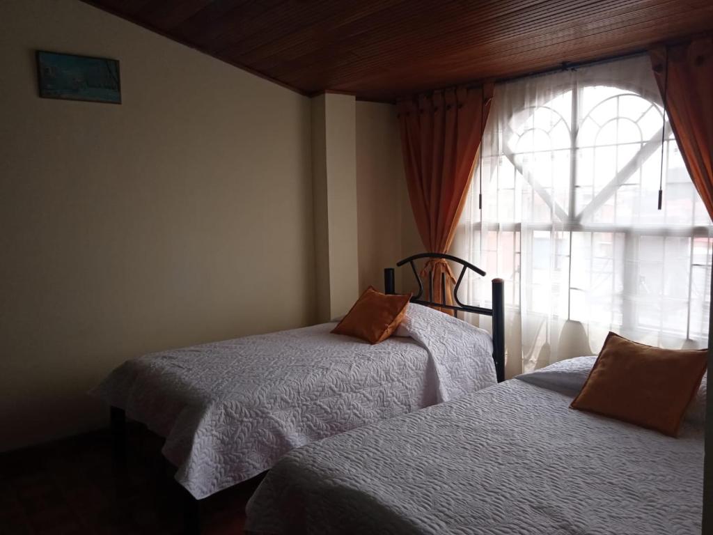 Postel nebo postele na pokoji v ubytování Habitaciones C&S Bogotá