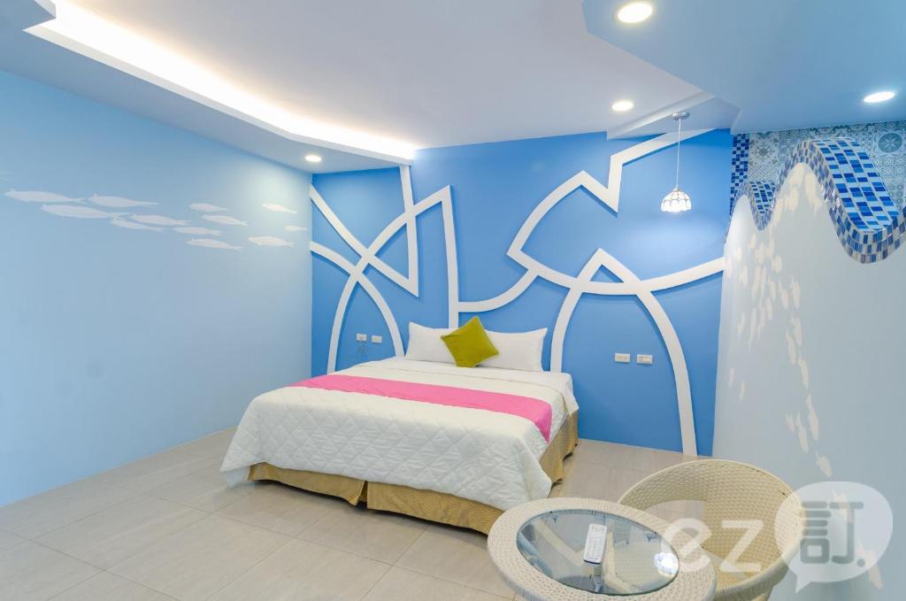 Postel nebo postele na pokoji v ubytování Mu Yu B&B