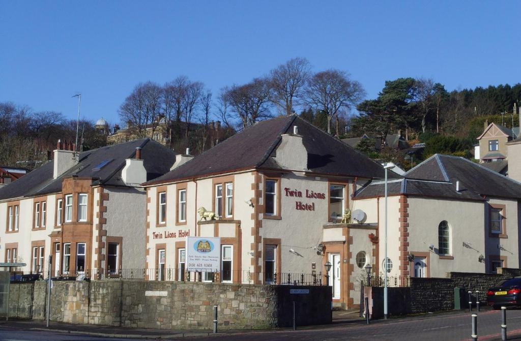 a building on the side of a street at Twin Lions Hotel in Edinburgh