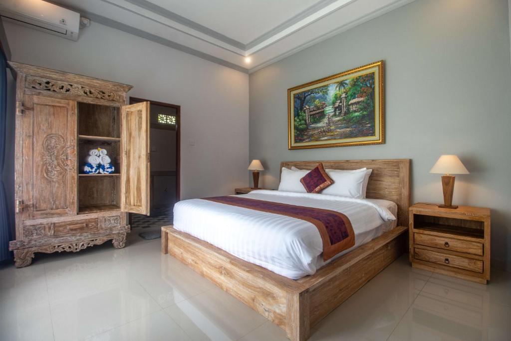 Postel nebo postele na pokoji v ubytování Asli Bali Villas by AGATA