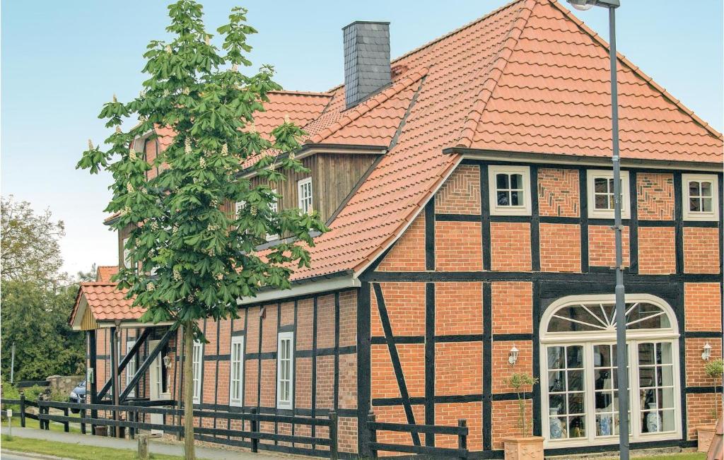 an old house with an orange roof at 3 Bedroom Gorgeous Apartment In Altenmedingen in Altenmedingen