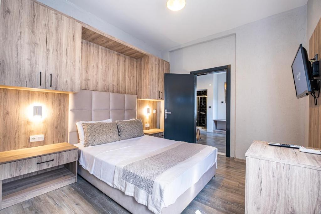 A bed or beds in a room at Hotel Centro Bodrum